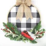It's not a farmhouse Christmas without buffalo plaid and a vintage red truck. This Buffalo Plaid Christmas Hoop Wreath is an easy farmhouse Christmas craft. This DIY Christmas wreath is an easy Christmas craft. If you love farmhouse style design, this is a perfect Christmas project to make for your home.