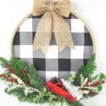 It's not a farmhouse Christmas without buffalo plaid and a vintage red truck. This Buffalo Plaid Christmas Hoop Wreath is an easy farmhouse Christmas craft. This DIY Christmas wreath is an easy Christmas craft. If you love farmhouse style design, this is a perfect Christmas project to make for your home.