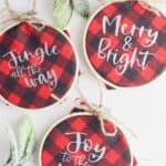 Homemade Christmas ornaments add a special touch to your tree. Add a farmhouse flair and make some Buffalo Plaid Hoop Ornaments. It's an easy Cricut Christmas craft. The DIY Christmas ornaments are easy to make and great to give. These embroidery hoop ornaments make a great DIY Christmas gift idea.
