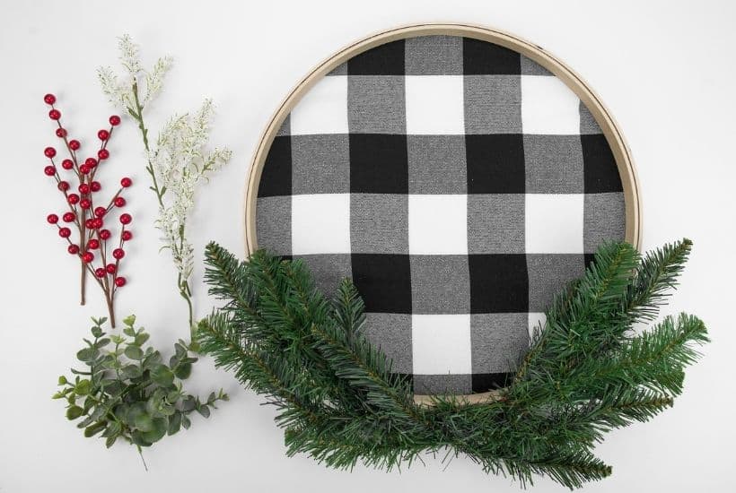 It's not a farmhouse Christmas without buffalo plaid and a vintage red truck. This Buffalo Plaid Christmas Hoop Wreath is an easy farmhouse Christmas craft.