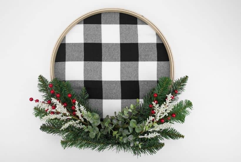 It's not a farmhouse Christmas without buffalo plaid and a vintage red truck. This Buffalo Plaid Christmas Hoop Wreath is an easy farmhouse Christmas craft.