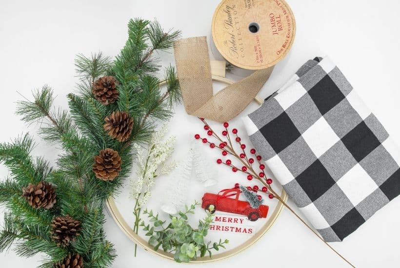 It's not a farmhouse Christmas without buffalo plaid and a vintage red truck. This Buffalo Plaid Christmas Hoop Wreath is an easy farmhouse Christmas craft.