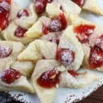 These flaky Cherry Cream Cheese Pinwheel Cookies are a twist on the traditional Hungarian Kolaches Christmas Cookie recipe.
