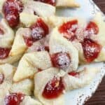 These flaky Cherry Cream Cheese Pinwheel Cookies are a twist on the traditional Hungarian Kolaches Christmas Cookie recipe.