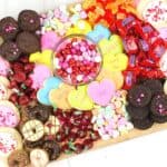 Kids and adults will love eating this Valentine's Day Dessert Board. Find out how to make an easy dessert board for Valentine's day filled with candy and treats. This Valentine’s Day charcuterie board is great to make for a party or tailor to any special holiday. Learn how to make a charcuterie board for your next party or gathering. Kids and adults will enjoy this easy dessert board filled with your favorite candies and sweet treats. Read more to find out how to make a holiday dessert board.