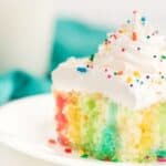 Make a colorful, moist, and utterly delicious cake within minutes with this Rainbow Poke Cake recipe. It is full of flavor and plenty of fun colors, including shades of pink, blue, and yellow!