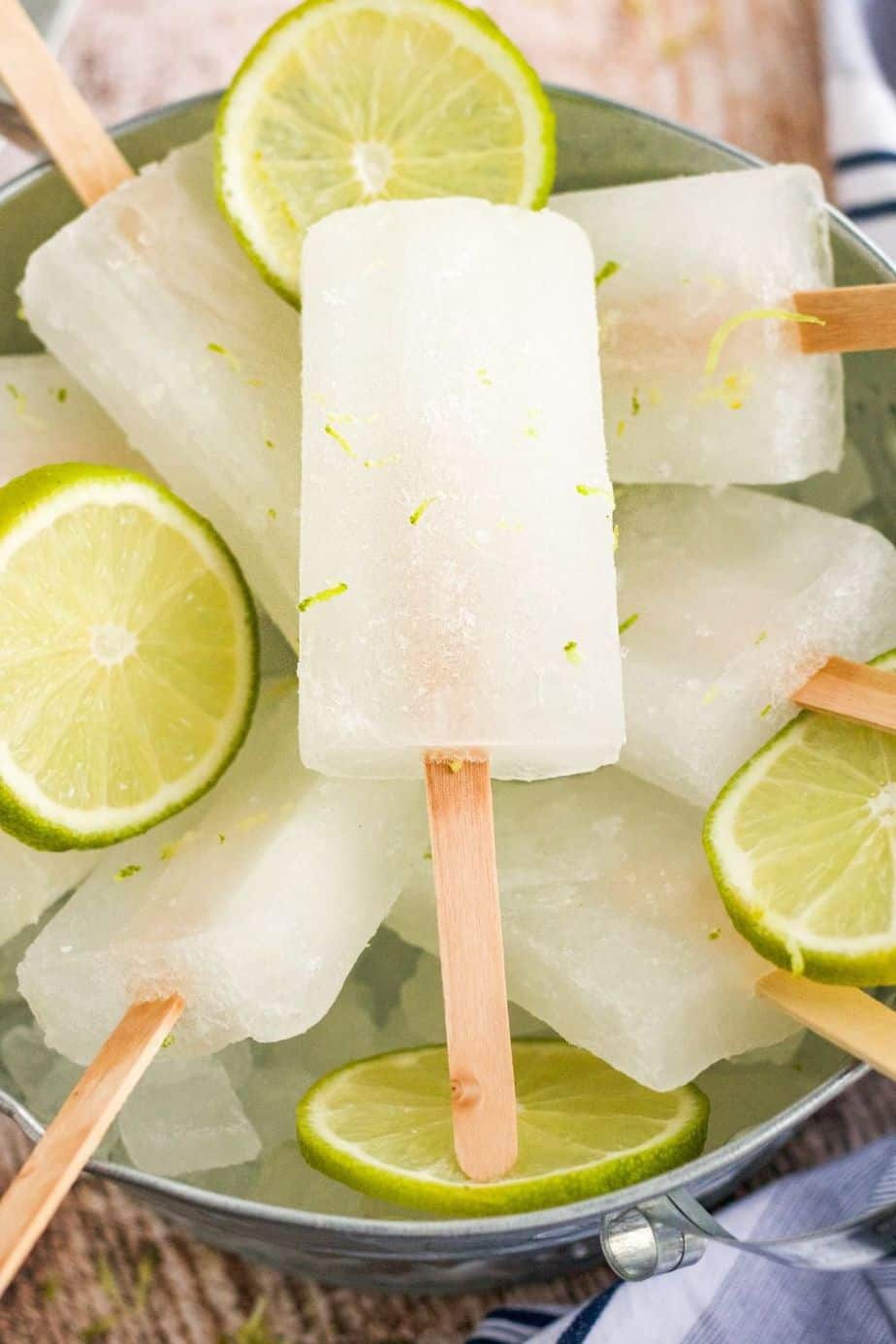Homemade lime popsicles are a refreshing treat. Full of bright lime flavor, this three-ingredient easy popsicle recipe is a perfect cool down for a warm summer's day.
