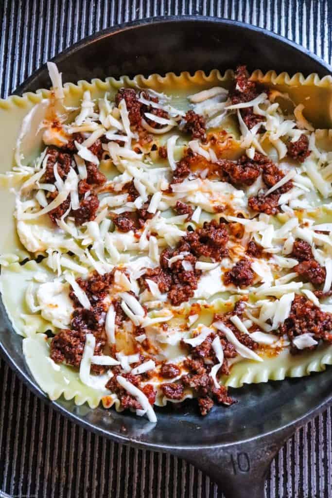 Cast Iron Skillet Lasagna is an easy twist on the classic Italian recipe. This Cast Iron Lasagna recipe makes a great weeknight meal idea. Grab your skillet and get cooking!