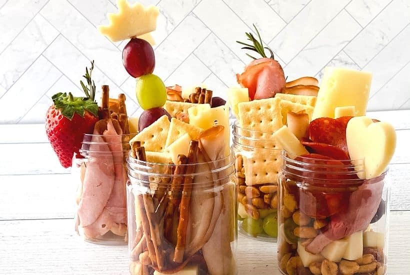 Jarcuterie Mason Jars are a fun alternative to a charcuterie board. These mason jar appetizers are individually portioned Charcuterie mason jars. They are an easy party idea to serve at your next gathering.