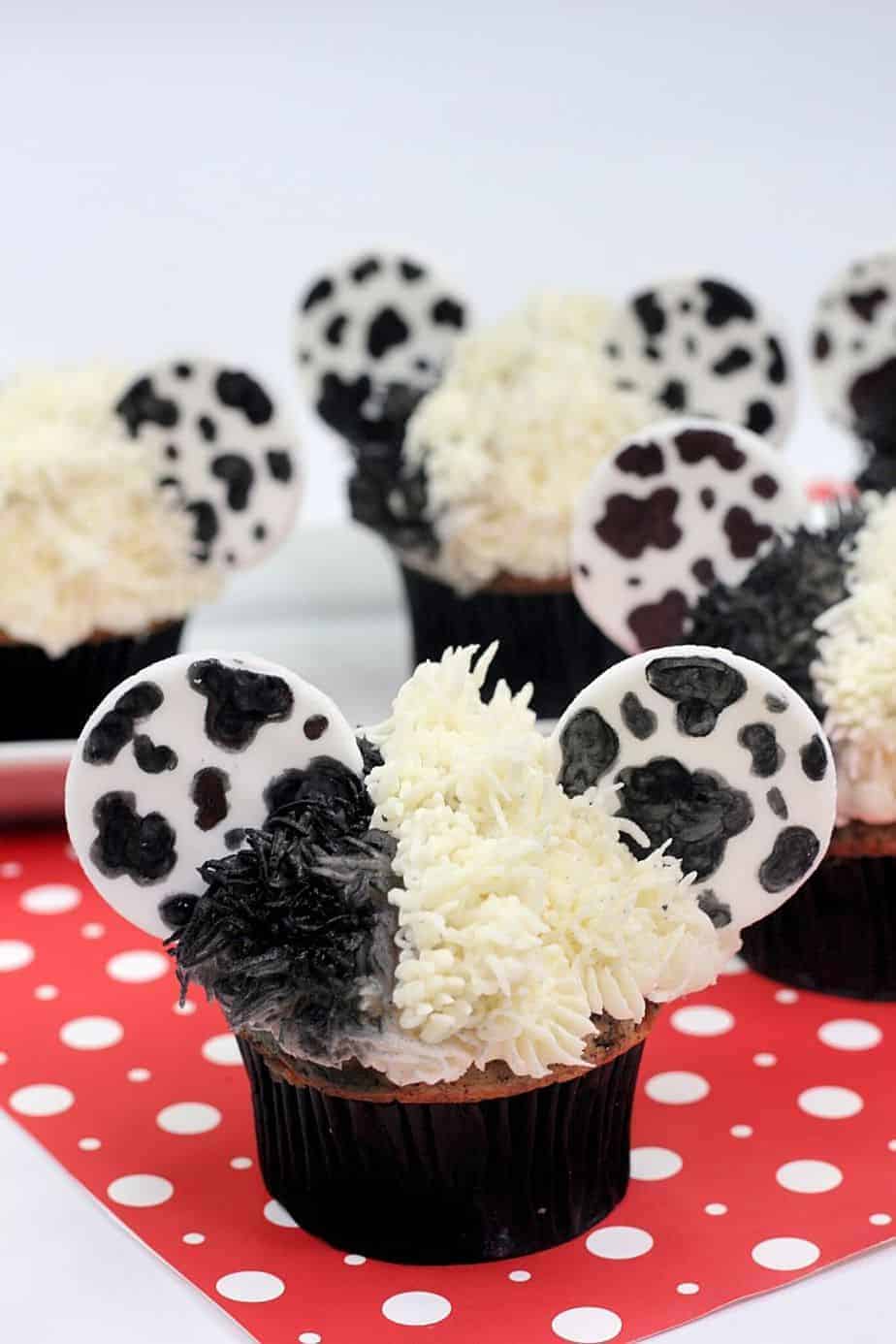 These Disney Cupcakes are inspired by the upcoming Disney movie Cruella. Make a batch of these Cruella de Vil cupcakes and celebrate the wickedness. This easy cupcake recipe is perfect for Disney fans. I love making Disney recipes at home. This Disney cupcake recipe is easy to make and easy to decorate. Celebrate your inner Disney Villain and whip up a batch of these Cruella cupcakes. These cupcakes are perfect for a 101 Dalmatians Party.