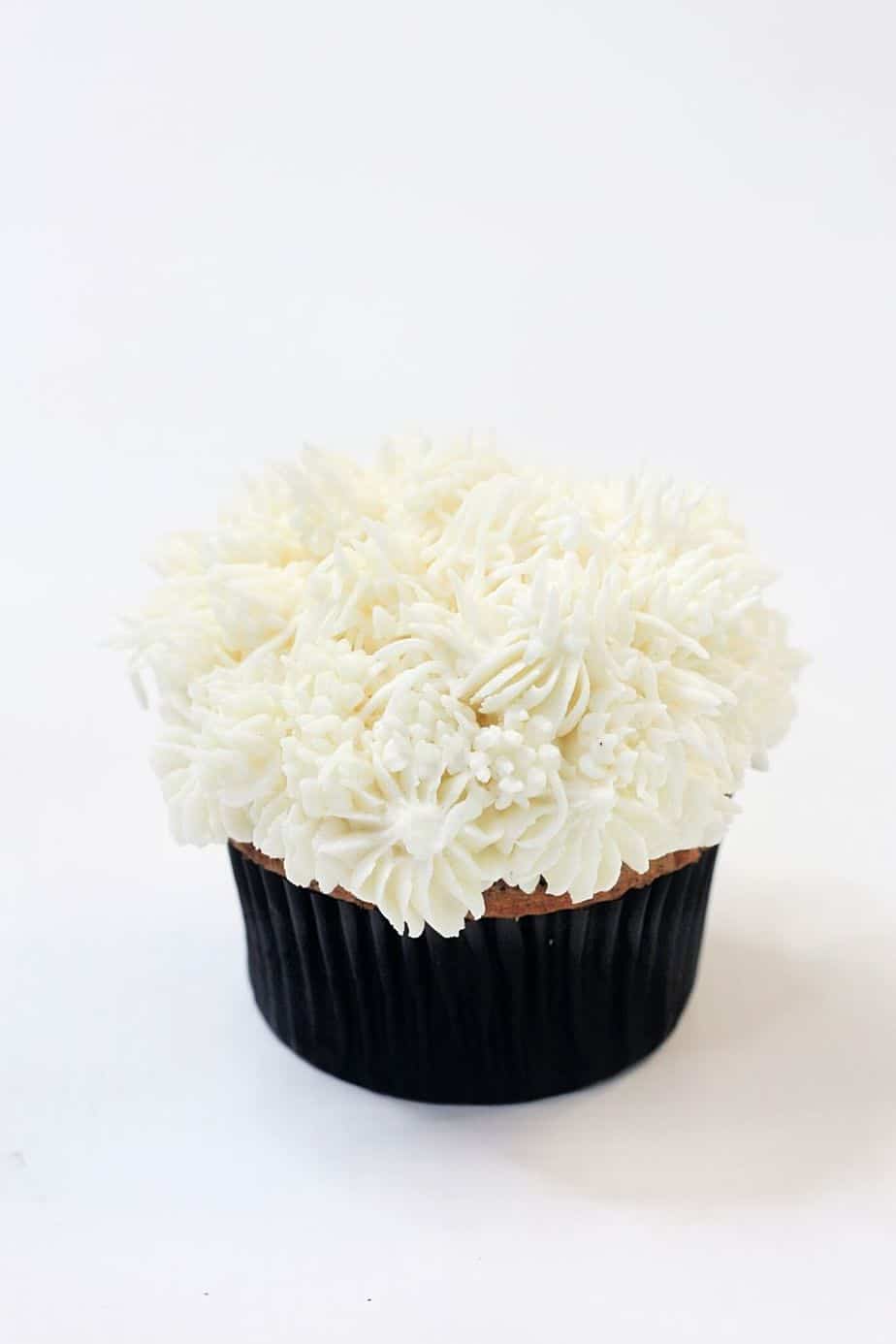 These Disney Cupcakes are inspired by the upcoming Disney movie Cruella. Make a batch of these Cruella de Vil cupcakes and celebrate the wickedness. This easy cupcake recipe is perfect for Disney fans. I love making Disney recipes at home. This Disney cupcake recipe is easy to make and easy to decorate. Celebrate your inner Disney Villain and whip up a batch of these Cruella cupcakes. These cupcakes are perfect for a 101 Dalmatians Party.
