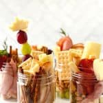 Jarcuterie Mason Jars are a fun alternative to a charcuterie board. These mason jar appetizers are individually portioned Charcuterie mason jars. They are an easy party idea to serve at your next gathering.