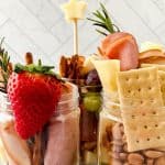 Jarcuterie Mason Jars are a fun alternative to a charcuterie board. These mason jar appetizers are individually portioned Charcuterie mason jars. They are an easy party idea to serve at your next gathering.