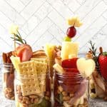 Jarcuterie Mason Jars are a fun alternative to a charcuterie board. These mason jar appetizers are individually portioned Charcuterie mason jars. They are an easy party idea to serve at your next gathering.