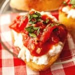 Need a quick appetizer recipe? Try this easy Burrata And Fire Roasted Tomato Bruschetta for your next party or gathering. Your guest will love this easy bruschetta recipe.