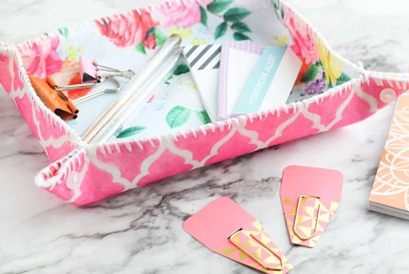 This simple DIY fabric tray is a fun sewing project you can make in just a few minutes. This easy craft project is perfect to display on your desk and use for home organization.