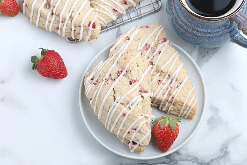 Impress your family with homemade baked goods that they can have for breakfast or a snack. This Strawberry Scones recipe is fun to make and will stay fresh for several days. These fresh-baked scones are soft, flaky and bursting with juicy strawberries! This is also a great freezer friendly recipe. Bake a batch of these fresh strawberry scones and freeze to enjoy at a later time.