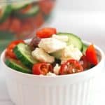 If you’d like a light and refreshing side dish, try this Greek Salad. It consists of healthy ingredients that are good for you, including cucumbers and red onions. This is an easy salad recipe to serve as a simple side dish, potluck recipe or at a summer picnic.