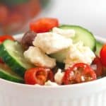 If you’d like a light and refreshing side dish, try this Greek Salad. It consists of healthy ingredients that are good for you, including cucumbers and red onions. This is an easy salad recipe to serve as a simple side dish, potluck recipe or at a summer picnic.