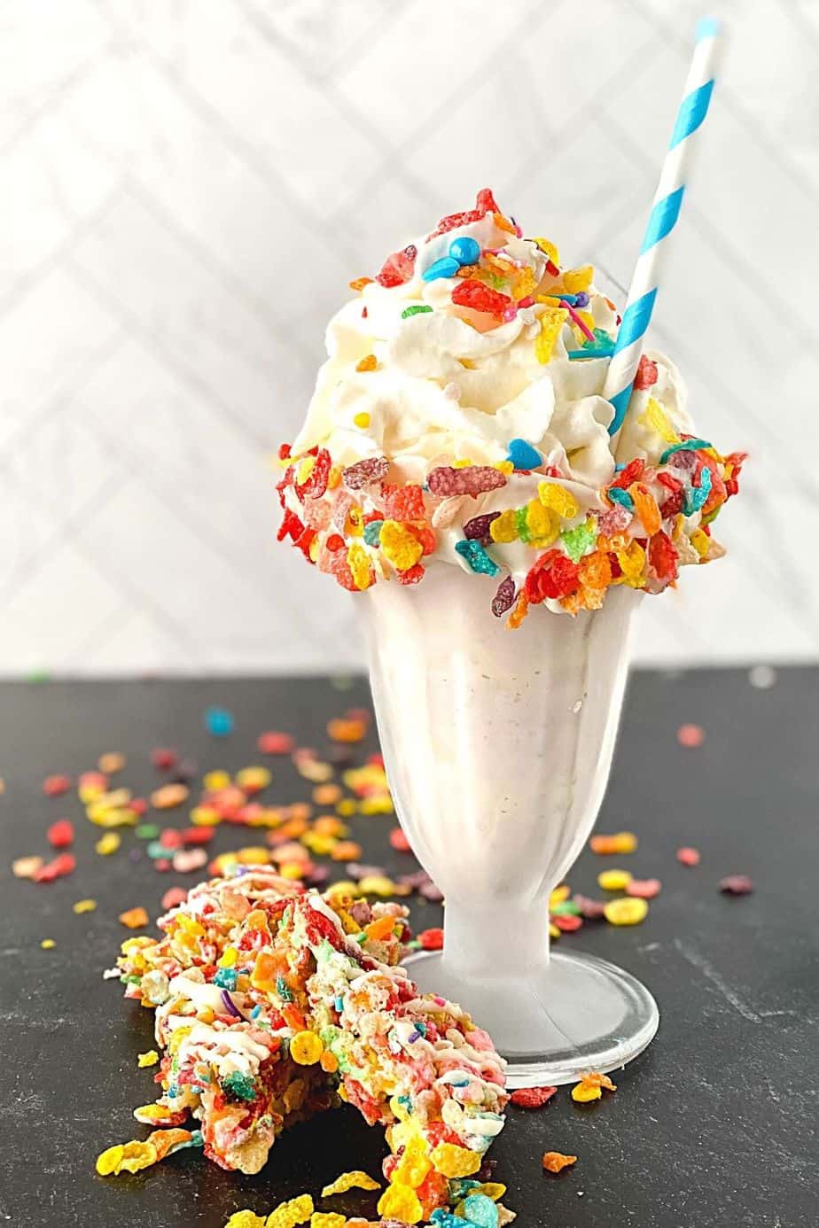 This is a milkshake recipe you don't want to pass up. This amazing Fruity Pebbles milkshake is Perfect blender Fruity Pebbles cereal vanilla ice cream milkshake for kids party food, Summer drink, or an easy dessert recipe. This creamy milkshake with Fruity Pebbles will definitely please any crowd. Check out the best vanilla Fruity Pebbles ice cream milkshake today.