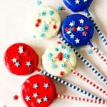 Patriotic Oreo Pops are a fun red, white and blue snack recipe to celebration the 4th of July or Memorial Day. Show you patriotic spirit and whip of a batch of these quick and easy cookie snacks.