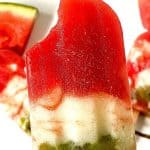 Stay hydrated and cool on a hot day with these flavorful Watermelon Pops. Made with fresh ingredients in a blender, these popsicles are delicious and naturally good for you. Watermelon Popsicles are a fresh frozen treat containing watermelon, kiwi, yogurt, and a few other ingredients. These pops get placed in the freezer until they’re cold and are perfect for consuming on a hot day.