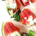 Stay hydrated and cool on a hot day with these flavorful Watermelon Pops. Made with fresh ingredients in a blender, these popsicles are delicious and naturally good for you. Watermelon Popsicles are a fresh frozen treat containing watermelon, kiwi, yogurt, and a few other ingredients. These pops get placed in the freezer until they’re cold and are perfect for consuming on a hot day.