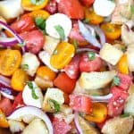 Tomato season calls for a delicious Jersey Fresh Panzanella Salad. Ripe juicy tomatoes pair up with rustic French baguette bread to create a delicious summer salad. This is an easy tomato salad recipe for summer. This panzanella bread salad is made with fresh tomatoes,, onion, mozzarella cheese and toasted bread cubes, all tossed in a homemade dressing.
