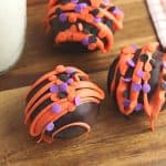 Fall is in the air and that calls for a warm treat. These Halloween Hot Cocoa Bombs are a perfect way to celebrate fall. Hot cocoa bombs for fall are filled with hot chocolate mix, miniature marshmallows and are nestled inside a delicious chocolate shell