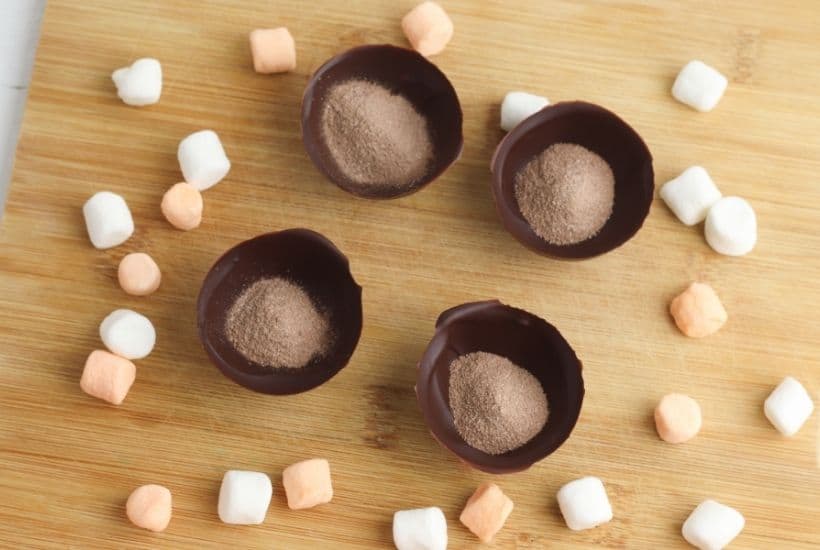Fall is in the air and that calls for a warm treat. These Halloween Hot Cocoa Bombs are a perfect way to celebrate fall. Hot cocoa bombs for fall are filled with hot chocolate mix, miniature marshmallows and are nestled inside a delicious chocolate shell