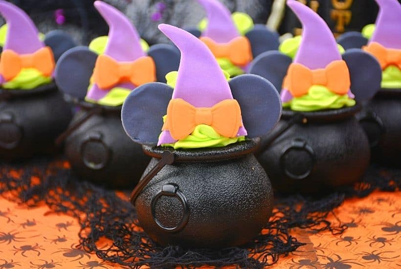 These bewitching Minnie Mouse Cauldron Cakes are a fun Halloween cupcake recipe to serve. You'll love this easy Halloween treat recipe. Disney fans will love making this easy cupcake recipe to celebrate Halloween and Disney. Minnie Mouse dressed in her best witch hat adorns the top of these mini-cauldron cakes. It's a fun Disney Halloween treat for kids or to make for a Halloween Party.