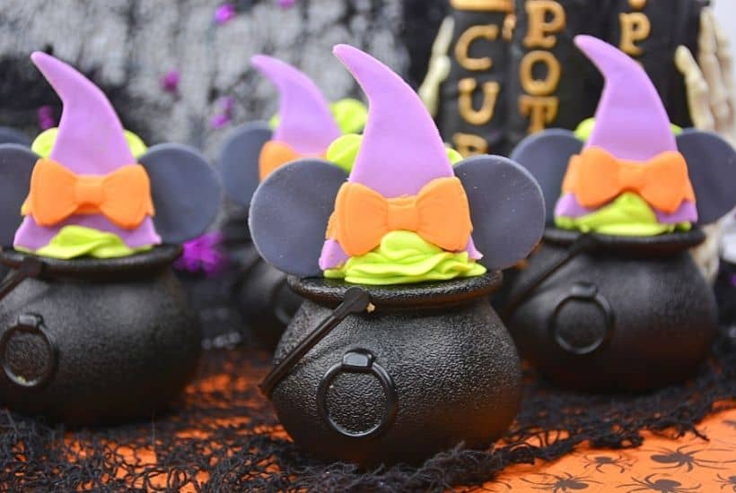 These bewitching Minnie Mouse Cauldron Cakes are a fun Halloween cupcake recipe to serve. You'll love this easy Halloween treat recipe. Disney fans will love making this easy cupcake recipe to celebrate Halloween and Disney. Minnie Mouse dressed in her best witch hat adorns the top of these mini-cauldron cakes. It's a fun Disney Halloween treat for kids or to make for a Halloween Party.