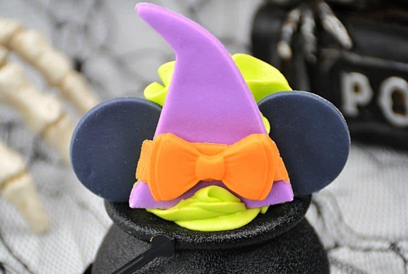 These bewitching Minnie Mouse Cauldron Cakes are a fun Halloween cupcake recipe to serve. You'll love this easy Halloween treat recipe. Disney fans will love making this easy cupcake recipe to celebrate Halloween and Disney. Minnie Mouse dressed in her best witch hat adorns the top of these mini-cauldron cakes. It's a fun Disney Halloween treat for kids or to make for a Halloween Party.
