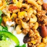 Prepare a fulfilling meal for the family with this wholesome and hearty Chili Mac. Loaded with flavor, this easy comfort food recipe is perfect to make for lunch or dinner with a side of cornbread or garlic bread! Chili Mac and Cheese is an easy weeknight meal idea.