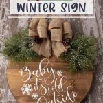 Make a decorative piece to hang in your home with this easy winter craft idea. Make a DIY Farmhouse Winter Sign that will add a special touch to any room in the home. This Christmas Cricut craft is a great project to make. It can be left up long after Christmas is over. Be sure to download the FREE SVG file - Baby It's Cold Outside too. Hang this sign on your entryway door or on a wall in your home.