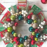 Deck the halls this holiday season with this DIY NJ Lottery ticket Christmas wreath. This unique ornament wreath is a great gift idea for friends and family too. What a perfect way to share some luck this holiday season.