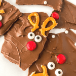 Learn how to make an easy and delicious treat to enjoy with family and friends for the holiday season. You’ll love the chocolatey taste of this sweet and simple chocolate Reindeer Bark recipe. This chocolate bark recipe is perfect recipe for a Christmas Cookie Exchange, holiday party or class party.