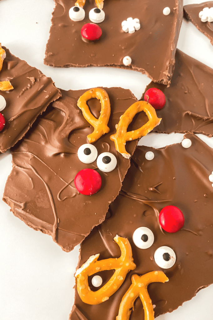 Learn how to make an easy and delicious treat to enjoy with family and friends for the holiday season. You’ll love the chocolatey taste of this sweet and simple chocolate Reindeer Bark recipe. This chocolate bark recipe is perfect recipe for a Christmas Cookie Exchange, holiday party or class party.