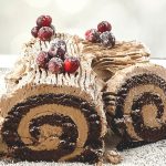 Get ready for the holidays with this fun Traditional Yule Log recipe. The Traditional Yule Log is a popular dessert commonly made during the holiday season in celebration of Christmas. The dessert consists of chocolate cake rolled with buttercream. While it looks like a giant version of a Swiss Roll, it tastes even better and is the perfect dessert to bring with you for any holiday dinners you plan on attending.