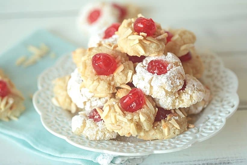 Get ready to prepare the tastiest Italian-style baked goods you’ve ever tried with this recipe for Italian Almond Cookies. Prepared with almond extract and other sweet ingredients, these cookies are full of flavor! These Italian Christmas Cookies are also great recipe to share at a Christmas Cookie Exchange. This easy cookie recipe is moist and full of almond flavor. Roll them in powdered sugar or slivered almonds and top with a candied cherry.