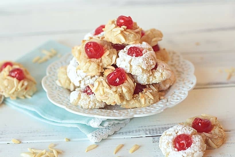 Get ready to prepare the tastiest Italian-style baked goods you’ve ever tried with this recipe for Italian Almond Cookies. Prepared with almond extract and other sweet ingredients, these cookies are full of flavor! These Italian Christmas Cookies are also great recipe to share at a Christmas Cookie Exchange. This easy cookie recipe is moist and full of almond flavor. Roll them in powdered sugar or slivered almonds and top with a candied cherry.