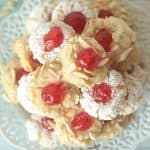 Get ready to prepare the tastiest Italian-style baked goods you’ve ever tried with this recipe for Italian Almond Cookies. Prepared with almond extract and other sweet ingredients, these cookies are full of flavor! These Italian Christmas Cookies are also great recipe to share at a Christmas Cookie Exchange. This easy cookie recipe is moist and full of almond flavor. Roll them in powdered sugar or slivered almonds and top with a candied cherry.