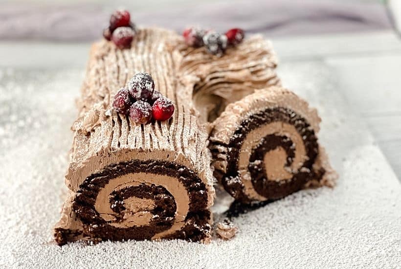 Get ready for the holidays with this fun Traditional Yule Log recipe. The Traditional Yule Log is a popular dessert commonly made during the holiday season in celebration of Christmas. The dessert consists of chocolate cake rolled with buttercream. While it looks like a giant version of a Swiss Roll, it tastes even better and is the perfect dessert to bring with you for any holiday dinners you plan on attending.