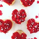 These red heart cupcakes are perfect for Valentine's Day. Learn how to make easy heart-shaped cupcakes to share with family and friends. I also share my best tips on how to freeze cupcakes in this post as well. This easy Valentine cupcake recipe is sure to win the hearts of your family and friends.