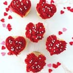 These red heart cupcakes are perfect for Valentine's Day. Learn how to make easy heart-shaped cupcakes to share with family and friends. I also share my best tips on how to freeze cupcakes in this post as well. This easy Valentine cupcake recipe is sure to win the hearts of your family and friends.