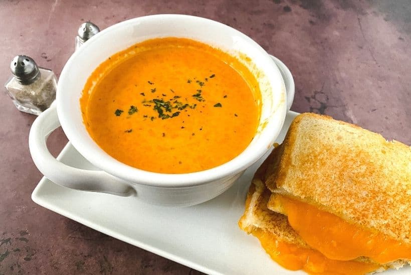 Satisfy your craving for something comforting and flavorful with this delicious Roasted Tomato Soup. Not only is it full of flavor, but it’s also easy to prepare and perfect for lunch, dinner, or even an appetizer. This easy homemade tomato soup recipe goes perfectly with a grilled cheese sandwich. This easy soup recipe is perfect for your lunch or dinner meal plan. It's the ultimate comfort food recipe.