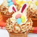 Enjoy the taste of these sweet, flavorful baked treats just in time for the Easter holiday with this recipe for Carrot Cake Bunny Cupcakes. Not only do they taste delicious, but they’re also so much fun to prepare! These Easter cupcakes are extra moist with a rich and silky cream cheese frosting swirled on top. These easy cupcakes are perfect for an Easter party or to serve as an Easter dessert after dinner.