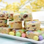 Make fun and flavorful Easter Cookie Bars for the holiday. These easy cookie bars are sure to be a huge hit for your Easter celebration. These thick and chewy M&M Cookies bars are perfect for any holiday or occasion. Fill them with chocolate chips, M&M's, or any chopped chocolate candy. They're also perfect to use up leftover Halloween candy.