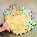 Make fun and flavorful Easter Cookie Bars for the holiday. These easy cookie bars are sure to be a huge hit for your Easter celebration. These thick and chewy M&M Cookies bars are perfect for any holiday or occasion. Fill them with chocolate chips, M&M's, or any chopped chocolate candy. They're also perfect to use up leftover Halloween candy.