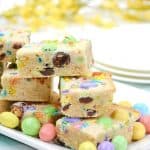 Make fun and flavorful Easter Cookie Bars for the holiday. These easy cookie bars are sure to be a huge hit for your Easter celebration. These thick and chewy M&M Cookies bars are perfect for any holiday or occasion. Fill them with chocolate chips, M&M's, or any chopped chocolate candy. They're also perfect to use up leftover Halloween candy.